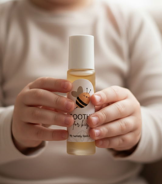 child holding a soothe roller blendin front of him, on a blurred background